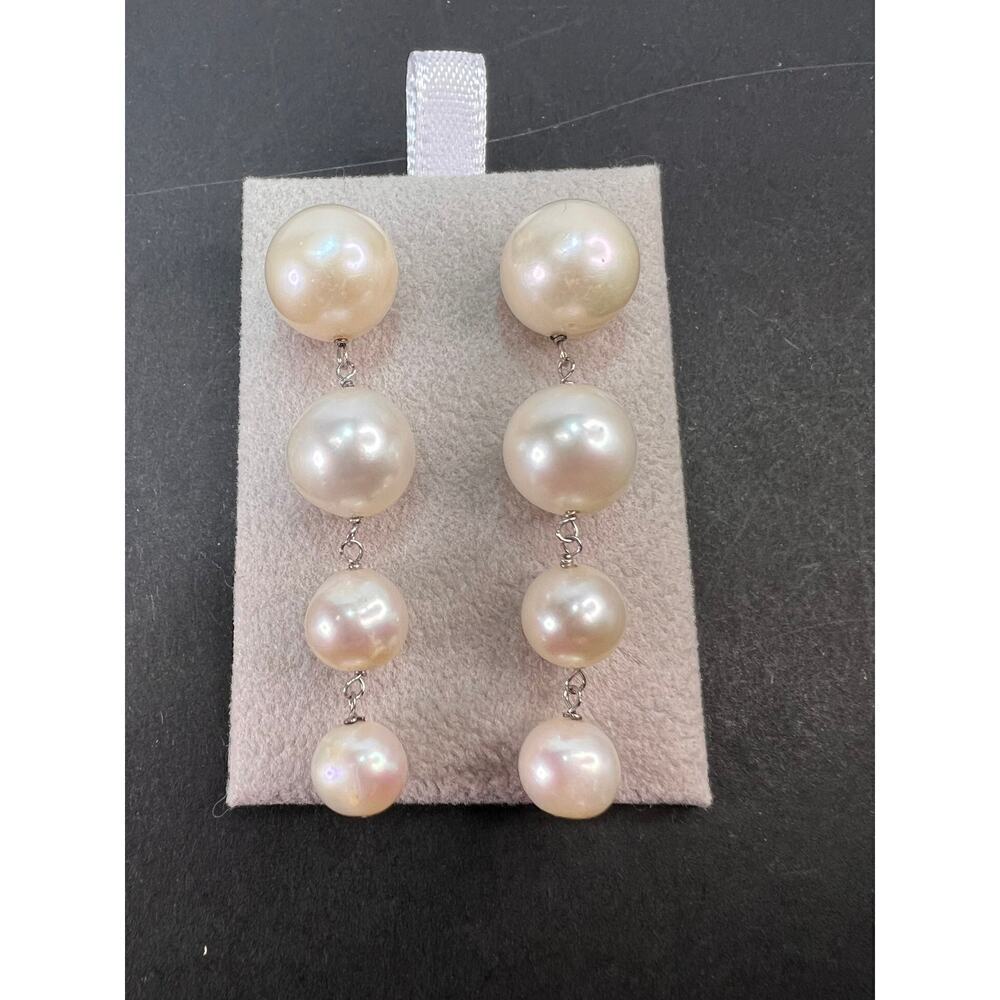 Graduated dangling pearl earrings in sterling silver